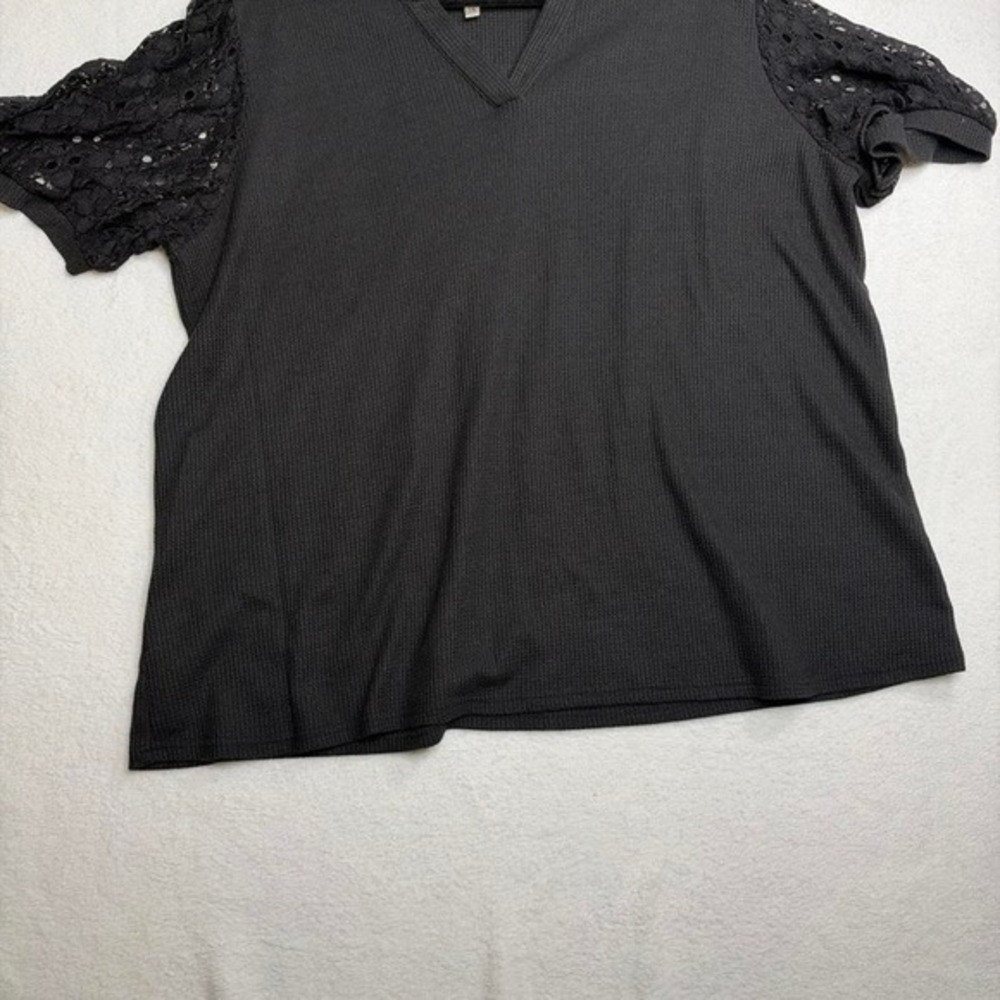 Black blouse with lace sleeves and V-neckline